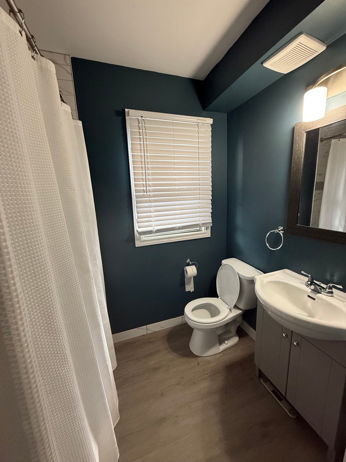 Bathroom after professional interior painting by The Hamilton Painting Company in Hamilton, Ontario — clean walls, ceiling, and trim in a modern finish